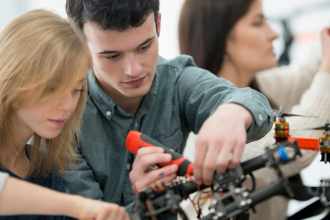 three-young-adults-building-a-drone-prototype-exploring-blue-collar-careers