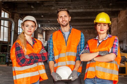 three-blue-collar-workers-two-women-and-one-men-posing-in-a-workshop
